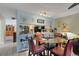 Open-concept living room with large windows and tile floors at 4348 Bowling Green Cir # 9, Sarasota, FL 34233