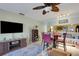 Comfortable living area featuring a ceiling fan, adjacent dining area, and stylish furnishings at 4348 Bowling Green Cir # 9, Sarasota, FL 34233