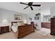 Comfortable main bedroom featuring carpet floors, a ceiling fan, and ample natural light at 4348 Bowling Green Cir # 9, Sarasota, FL 34233