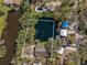 Aerial view displays house with pond, neighborhood, and outlined property lines at 4540 Murdock Ave, Sarasota, FL 34231