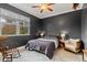 Inviting bedroom with dark walls and an area rug, complemented by natural light and neutral accents at 4540 Murdock Ave, Sarasota, FL 34231