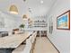 Kitchen island with breakfast bar seating and stone accents at 4540 Murdock Ave, Sarasota, FL 34231