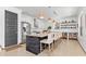 Kitchen island with breakfast bar and stainless steel appliances at 4540 Murdock Ave, Sarasota, FL 34231