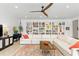 Bright and airy living room featuring a large sectional sofa, built-in bookshelves, and stylish decor at 4540 Murdock Ave, Sarasota, FL 34231