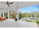 Spacious covered patio overlooking a serene pond, complete with hammocks and comfortable seating at 4540 Murdock Ave, Sarasota, FL 34231