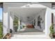 Inviting porch with ample seating, string lights, and ceiling fans for relaxing outdoor living at 4540 Murdock Ave, Sarasota, FL 34231