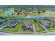 An aerial view shows a beautiful home on a manicured lot near a tranquil lake at 4789 Vasca Dr, Sarasota, FL 34240