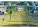 Aerial view of home with expansive lawn next to a beautiful lake at 4789 Vasca Dr, Sarasota, FL 34240