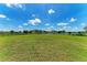 Expansive backyard featuring lush green grass and ample space for outdoor activities at 4789 Vasca Dr, Sarasota, FL 34240