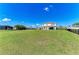 Expansive backyard with lush lawn and patio, perfect for outdoor entertaining and relaxation at 4789 Vasca Dr, Sarasota, FL 34240