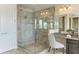 Luxurious bathroom showcasing a walk-in glass shower and a vanity area with modern fixtures at 4789 Vasca Dr, Sarasota, FL 34240