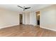 Bedroom with hardwood flooring, ceiling fan, and lots of space at 4789 Vasca Dr, Sarasota, FL 34240
