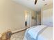 Bedroom with hardwood floors and walk-in closet at 4789 Vasca Dr, Sarasota, FL 34240