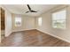 Bedroom with hardwood flooring and lots of windows at 4789 Vasca Dr, Sarasota, FL 34240
