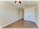 Bedroom showcasing hardwood floors, a closet, and ensuite bathroom at 4789 Vasca Dr, Sarasota, FL 34240