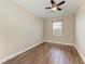 Bedroom with hardwood flooring, ceiling fan, and natural light at 4789 Vasca Dr, Sarasota, FL 34240