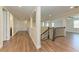 Upstairs hallway featuring wood floors and an overlook to downstairs at 4789 Vasca Dr, Sarasota, FL 34240