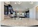 Spacious kitchen with dark cabinetry, granite countertops, and stainless steel appliances at 4789 Vasca Dr, Sarasota, FL 34240
