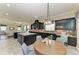 Spacious kitchen with island, breakfast nook and view of the open concept living room at 4789 Vasca Dr, Sarasota, FL 34240
