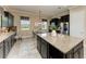 Open kitchen with island, granite counters, stainless appliances, and eat in breakfast nook at 4789 Vasca Dr, Sarasota, FL 34240