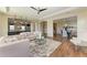 Spacious living room with open layout, seamlessly connected to the kitchen and dining areas at 4789 Vasca Dr, Sarasota, FL 34240