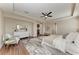 Spacious main bedroom with hardwood floors, sitting area, and tray ceiling at 4789 Vasca Dr, Sarasota, FL 34240