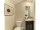 Powder room with single granite vanity and toilet at 4789 Vasca Dr, Sarasota, FL 34240