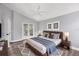 Large bright main bedroom with fan and french doors at 5047 82Nd E Way, Sarasota, FL 34243