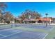 Community tennis courts and pool, a covered picnic area, and mature landscaping at 5047 82Nd E Way, Sarasota, FL 34243