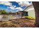 Backyard featuring a fenced in yard and enclosed patio attached to the home at 5110 76Th E St, Bradenton, FL 34203