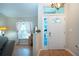 Bright foyer featuring decorative front door with transom window and chandelier at 5110 76Th E St, Bradenton, FL 34203