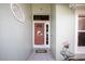 Front entrance showcasing a decorative storm door and tile flooring at 5110 76Th E St, Bradenton, FL 34203