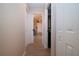 Inviting hallway with neutral tones and doors leading to the various rooms in the house at 5110 76Th E St, Bradenton, FL 34203