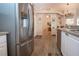 Kitchen featuring stainless steel refrigerator and wood-look flooring at 5110 76Th E St, Bradenton, FL 34203