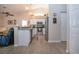 Open kitchen features stainless steel appliances, granite countertops, and wood-look floors at 5110 76Th E St, Bradenton, FL 34203