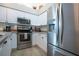 Bright kitchen with stainless steel appliances and ample counter space at 5110 76Th E St, Bradenton, FL 34203
