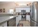 This well-equipped kitchen offers stainless steel appliances and granite countertops at 5110 76Th E St, Bradenton, FL 34203