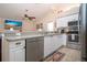 Modern kitchen with stainless steel appliances and convenient breakfast bar at 5110 76Th E St, Bradenton, FL 34203