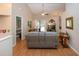 Bright living room featuring hardwood floors, comfortable sofa, and sliding glass doors at 5110 76Th E St, Bradenton, FL 34203