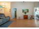 Open concept living room with vaulted ceilings, and sliding glass doors to lanai and pool at 5110 76Th E St, Bradenton, FL 34203