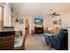 Comfortable living room with an entertainment center, ceiling fan, and ample seating space at 5110 76Th E St, Bradenton, FL 34203