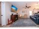 Spacious living room with a fireplace, blue sofa, recliner, and decorative rug at 5110 76Th E St, Bradenton, FL 34203