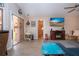 Bright living room with access to the outdoor patio, featuring a fireplace and ample seating at 5110 76Th E St, Bradenton, FL 34203
