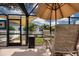 Enjoy the outdoors on this beautiful patio with outdoor seating and views of the lush backyard at 5110 76Th E St, Bradenton, FL 34203