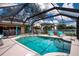 Enjoy the sparkling screened-in pool and lounge chairs in this private backyard oasis at 5110 76Th E St, Bradenton, FL 34203