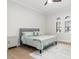 Serene bedroom with neutral colors, a cozy bed, and stylish window shutters allowing natural light at 5142 Cote Du Rhone Way, Sarasota, FL 34238