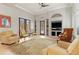 Comfortable clubhouse area with seating, a TV, and an EXIT to the outdoor patio at 5142 Cote Du Rhone Way, Sarasota, FL 34238