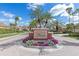 Beautiful entrance to the Vineyards community with lush landscaping and clear blue skies at 5142 Cote Du Rhone Way, Sarasota, FL 34238