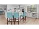 Bright kitchen with modern cabinetry, breakfast bar seating, and stainless steel appliances at 5142 Cote Du Rhone Way, Sarasota, FL 34238