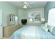 Cozy bedroom with a comfortable bed and an expansive window with plantation shutters at 5250 Hyland Hills Ave # 1514, Sarasota, FL 34241
